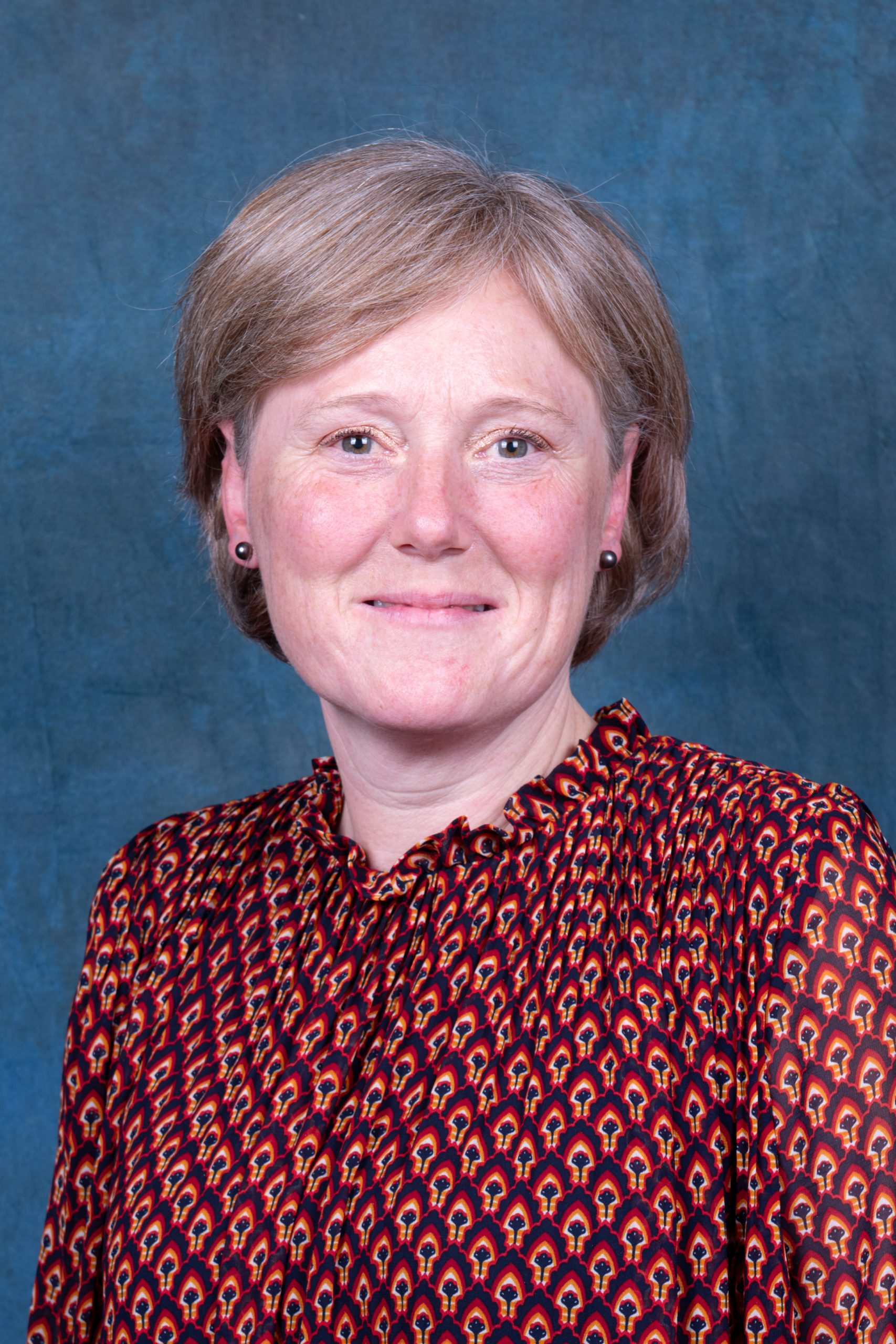 woman with brown hair and black eyes