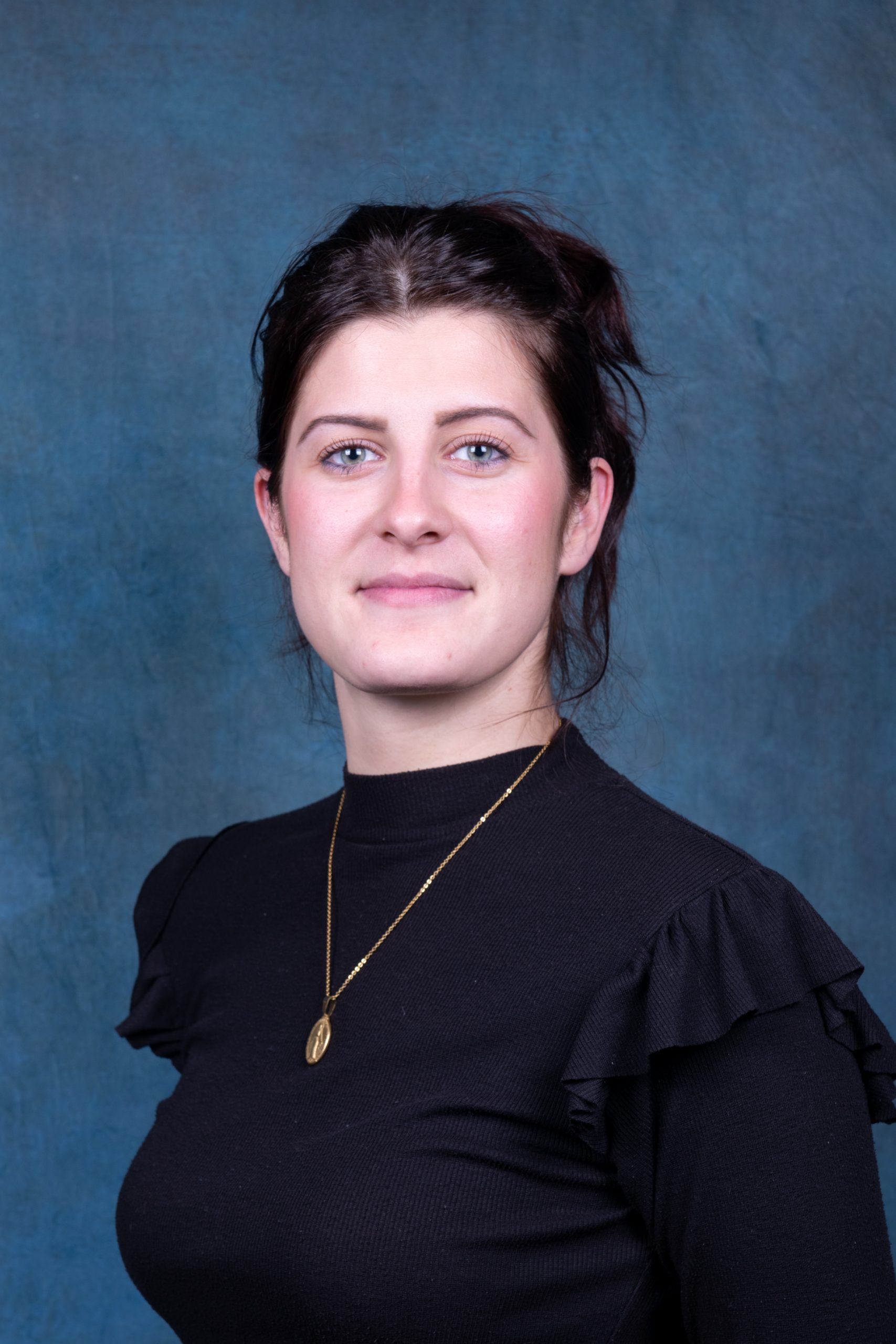 woman with brown hair and black eyes
